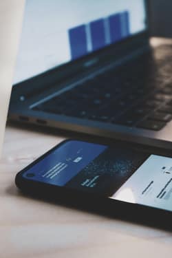 Cell Phone On Desk Running Field Service Management Software